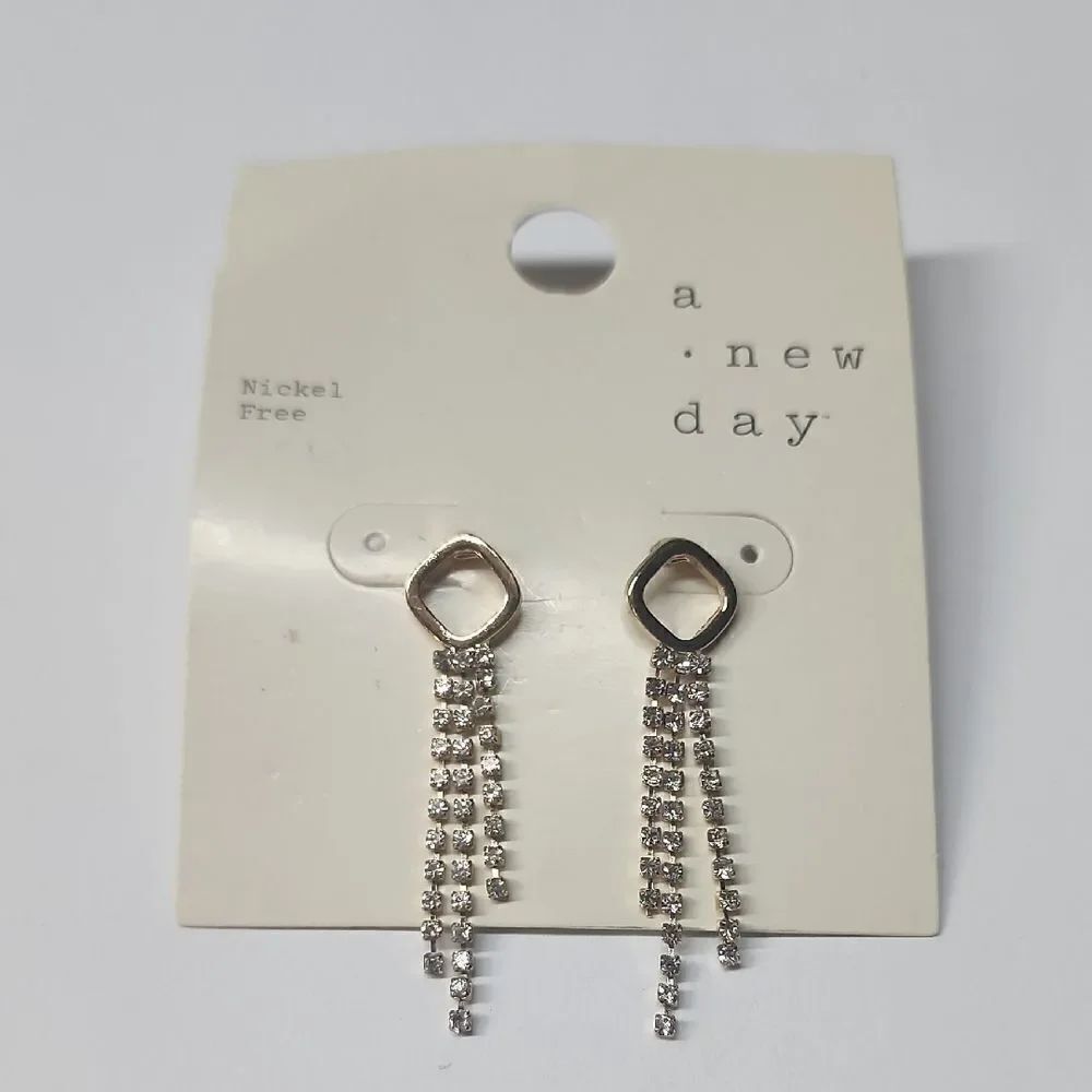 a new day Gold Earrings with minimalist design and elongated dangles